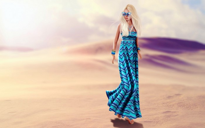 Woman in blue dress walking in desert