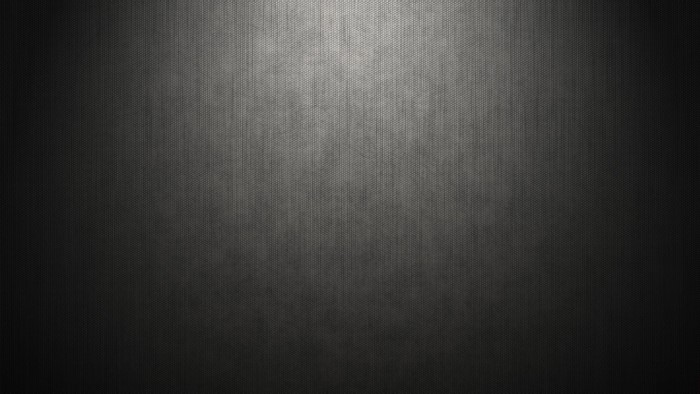 Dark textured surface with light gradient