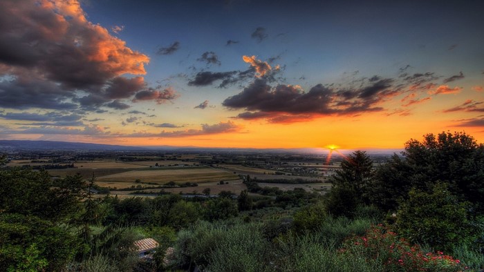 Sunset over a rural landscape with clouds