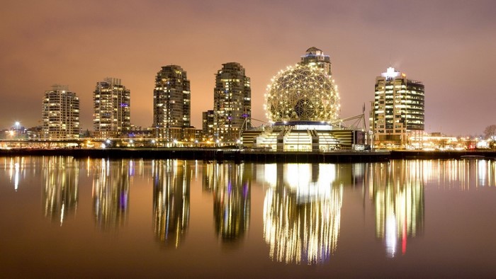 Vancouver cityscape at night with Science World reflection