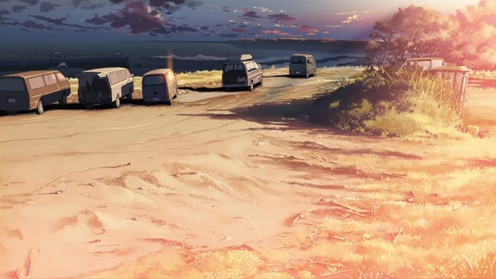 Anime screenshot of vans parked by the beach at sunset