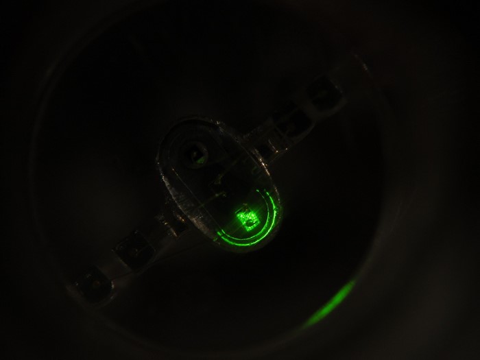 Close-up of a green illuminated electronic component