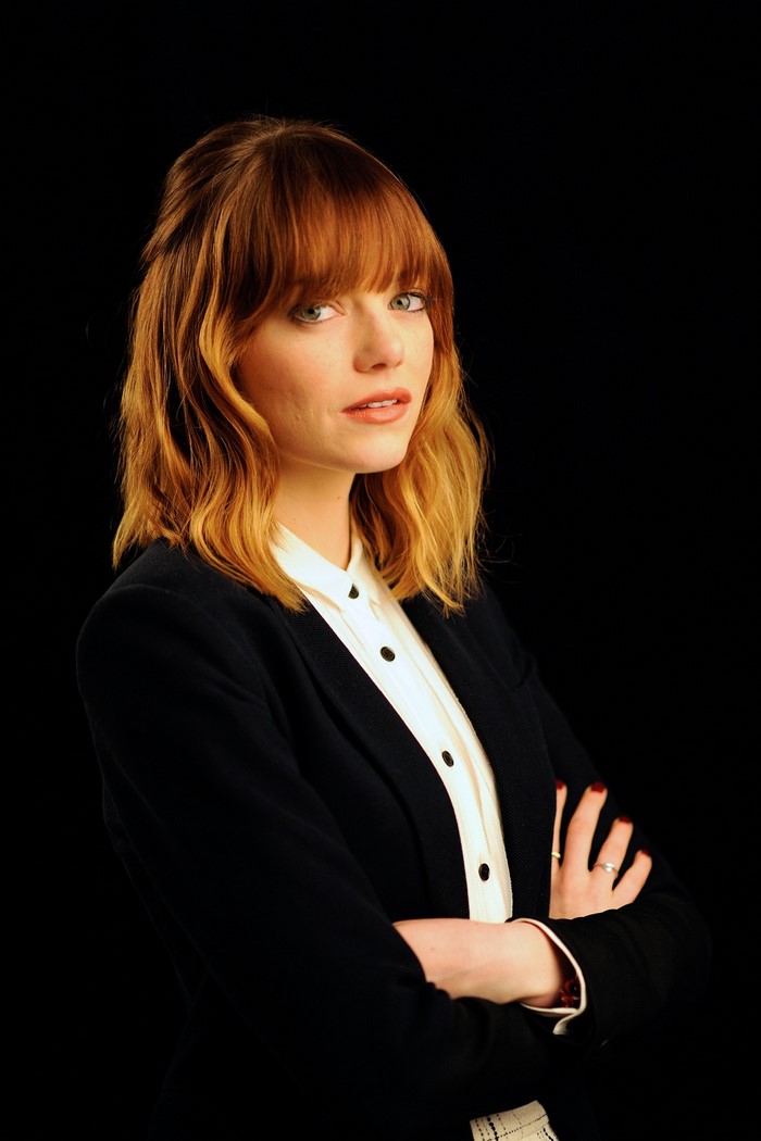 Emma Stone in a black blazer and white shirt