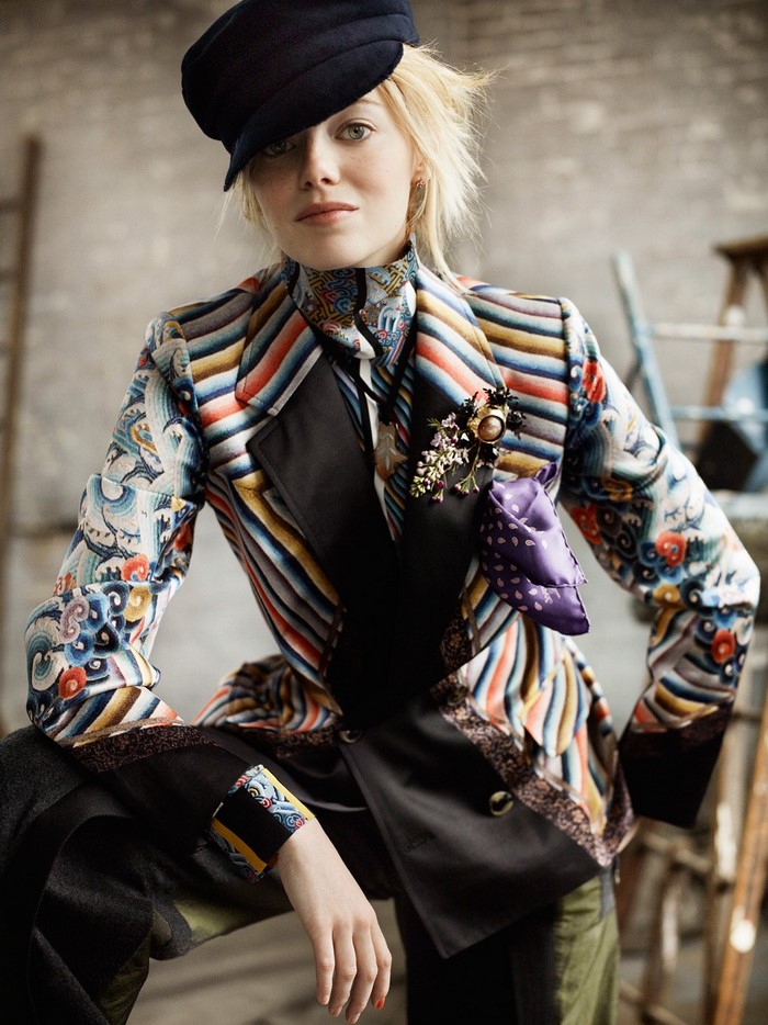 Emma Stone in colorful patterned suit and cap