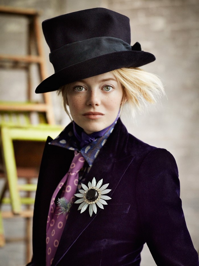 Emma Stone in a purple velvet suit and top hat