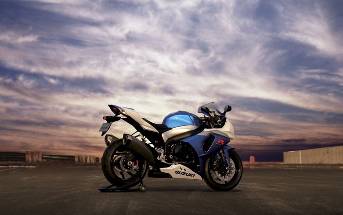 Blue and white Suzuki GSX-R motorcycle on a stand