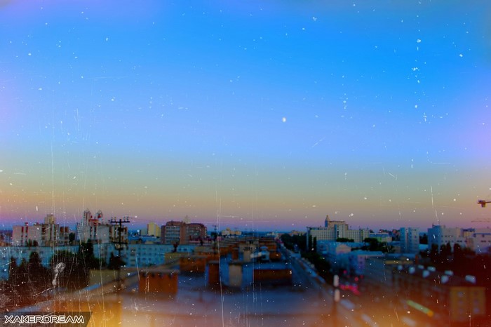 Cityscape at dusk with a gradient sky