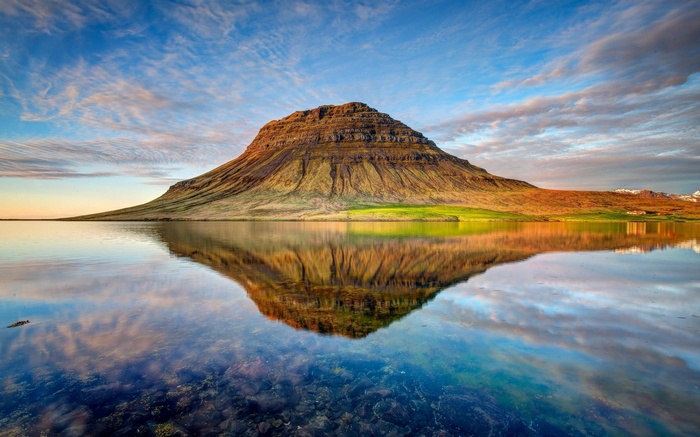 Kirkjufell mountain reflected in water