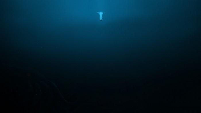 Deep ocean with a creature and light