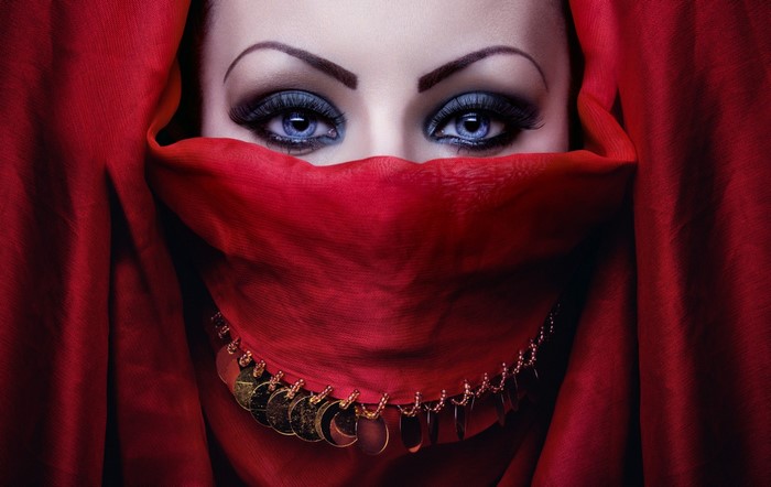 Woman with red veil and gold jewelry