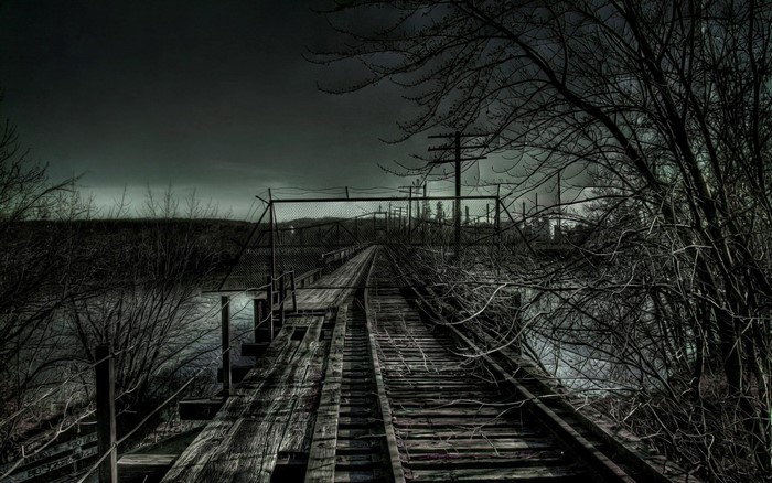 Abandoned railway bridge at night