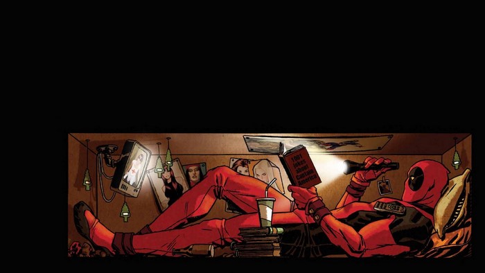Deadpool reading a book in a box
