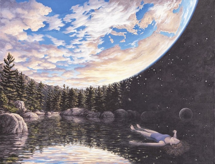 Woman floating in water with planet and forest landscape