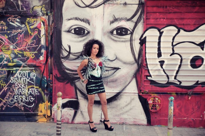 La Yegros in front of graffiti art