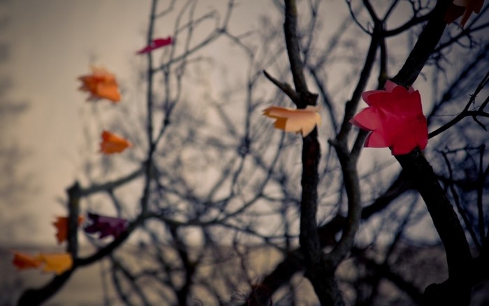 Paper flowers on a tree branch