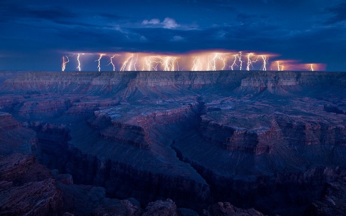 Lightning strikes over the Grand Canyon at dusk