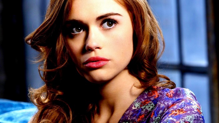 Holland Roden portrait with red lipstick and floral top