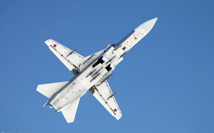 Sukhoi Su-24 military aircraft flying in the sky