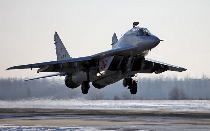 Mikoyan MiG-29 taking off from a snowy runway