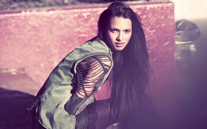 Lais Ribeiro posing in a ripped jacket