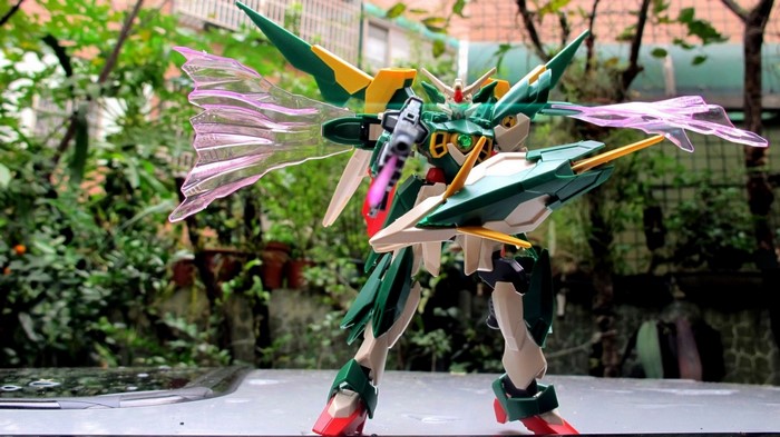 Gundam toy with pink wings and green armor