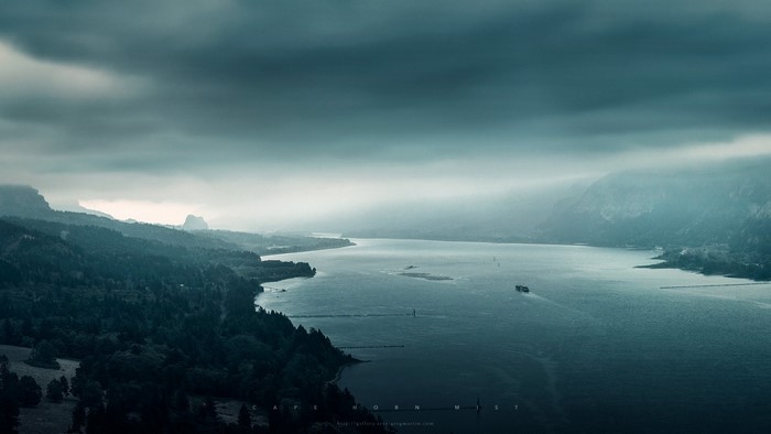 Misty River Fjord at Dusk Under Cloudy Sky