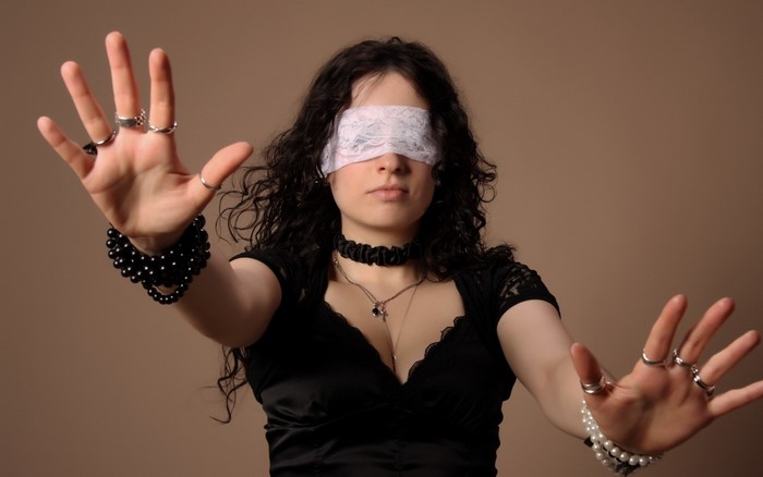 Woman with blindfold and jewelry