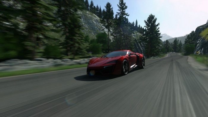 Red supercar driving on a mountain road in Driveclub