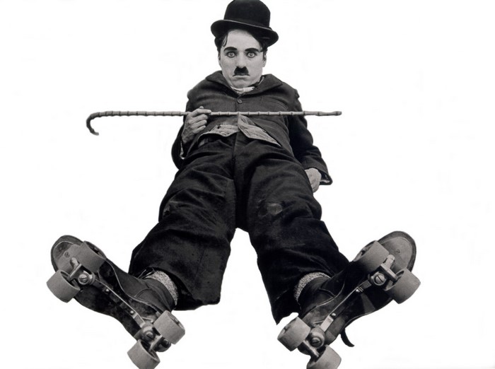 Charlie Chaplin as The Tramp on roller skates