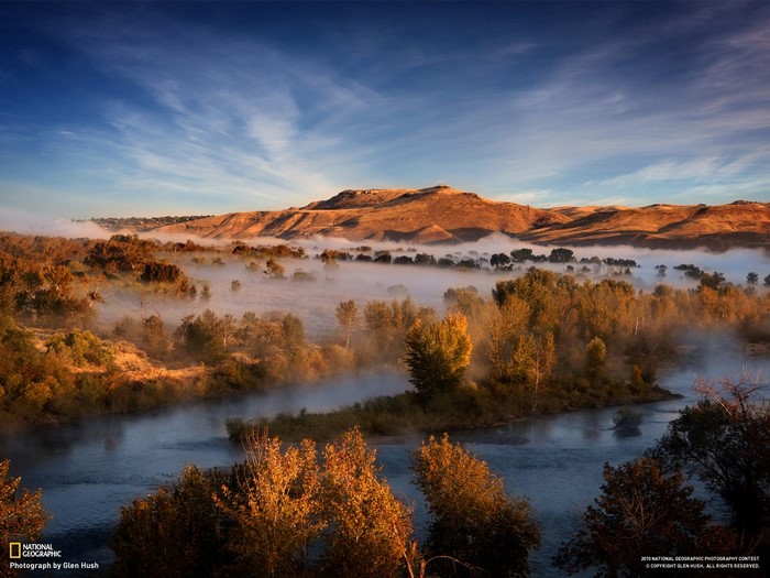 Misty River Valley at Sunrise with Mountains