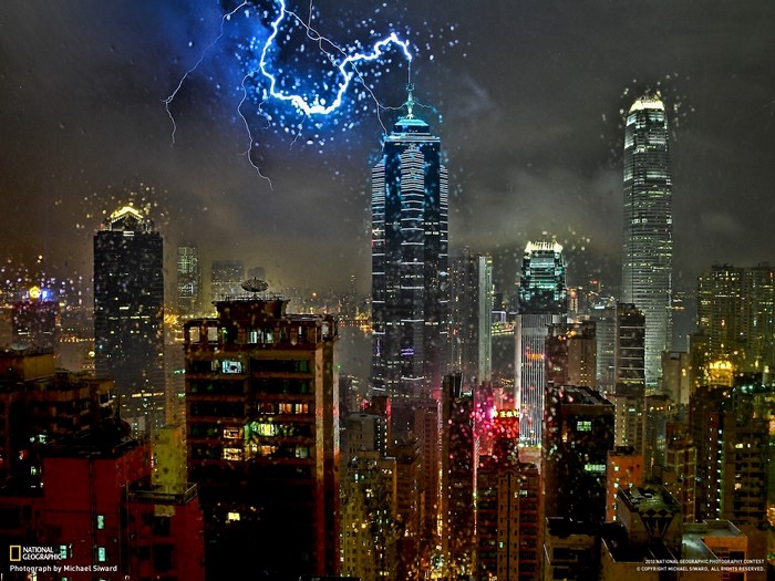 Hong Kong cityscape at night with lightning strike