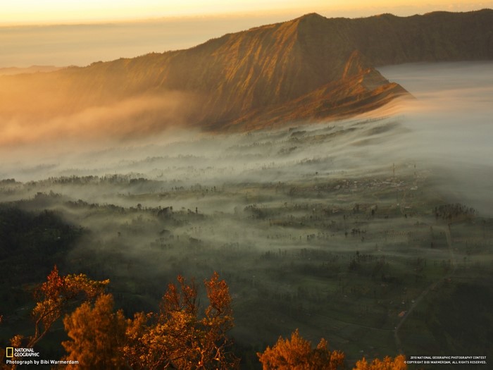 Mountain landscape with mist at sunrise