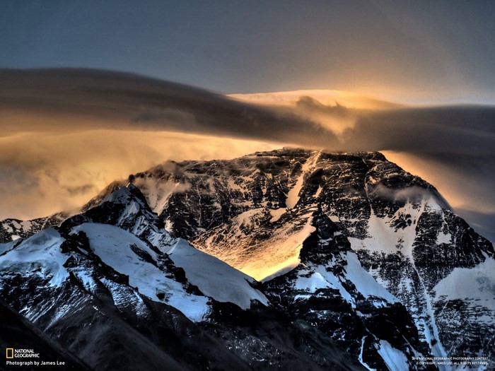 Mount Everest at sunrise with lenticular clouds