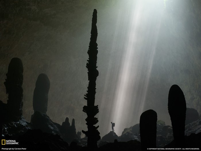 Cave with stalagmites and sunbeams, National Geographic