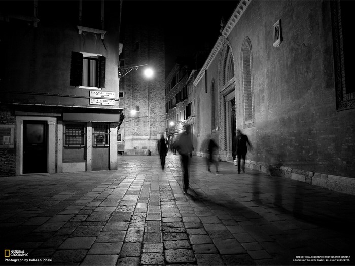 Venice at Night: Figures on a Cobblestone Street