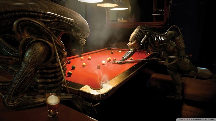 Xenomorph and Predator playing billiards