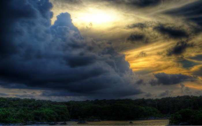 Stormy sunset over a tropical coastline