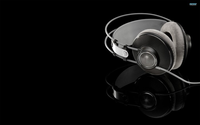 AKG Headphones on a reflective black surface
