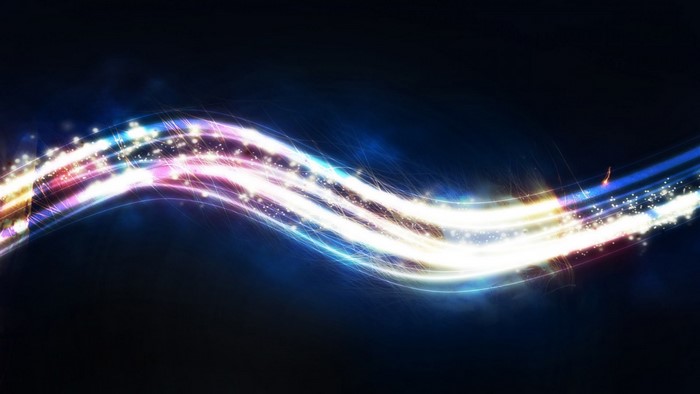 Abstract light waves with sparkles on dark background