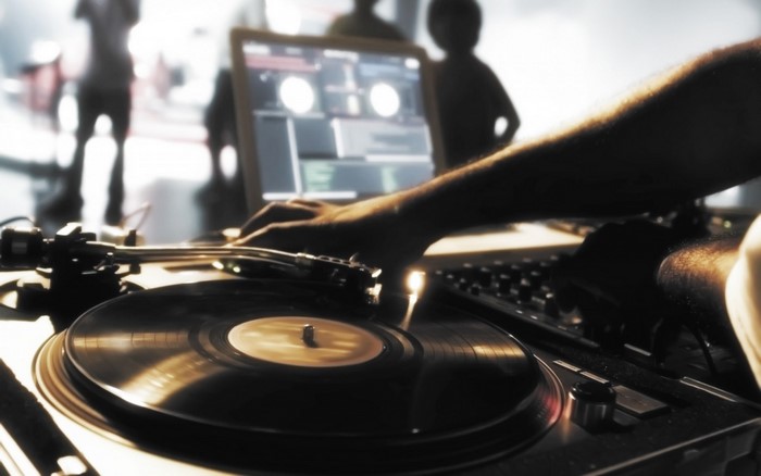 DJ playing vinyl records on turntable