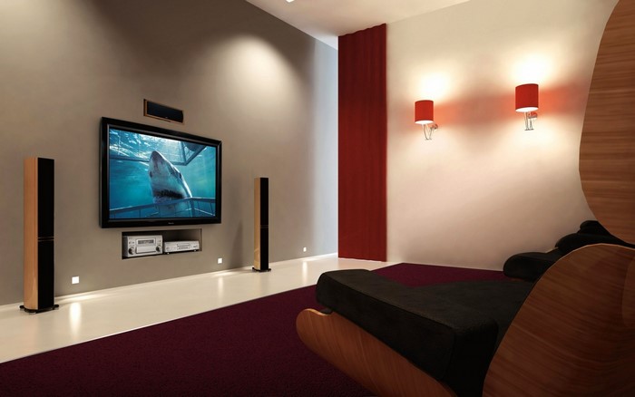 Modern living room with entertainment system and red accents
