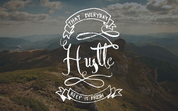 Hustle typography with mountain landscape