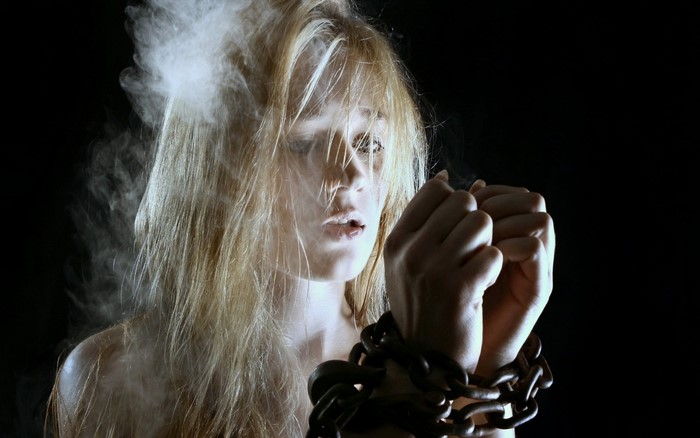 Woman with chains and smoke