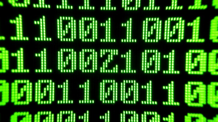 Green binary code on a black background