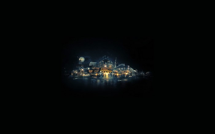 City buildings at night with lights reflecting on water