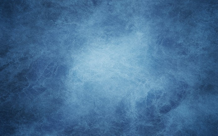 Blue textured background with light in the center