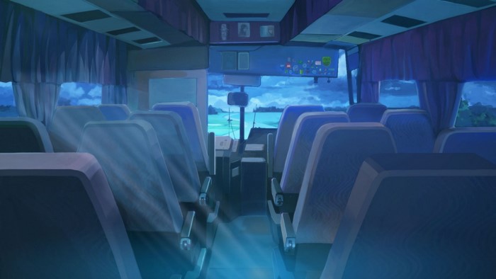 Interior of a bus at night with view of the sea