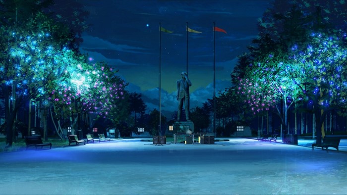 Park at night with statue and lights