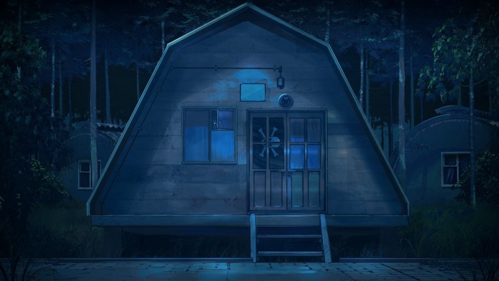 A-frame house with skull and bones on door at night