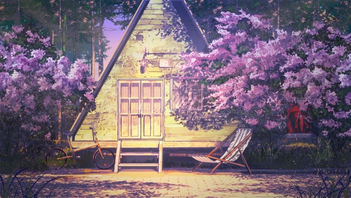 A-frame house with blooming purple flowers and a bicycle